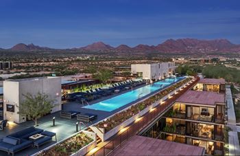 Expansive sundeck with poolside lounge chairs